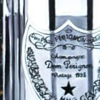 Close-up view of the Dom Perignon label in the painting, highlighting the detailed oil rendering
