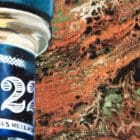 Zoomed-in segment of Monica Marquez Gatica's LAWS Fluid Whiskey painting, showcasing the swirling patterns of her acrylic pouring technique.