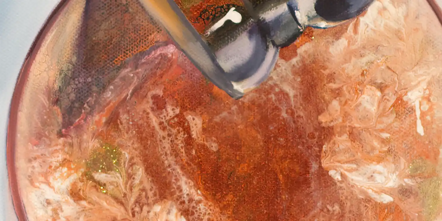 Close-up of champagne being poured into a glass, capturing the lively bubbles and vibrant colors.