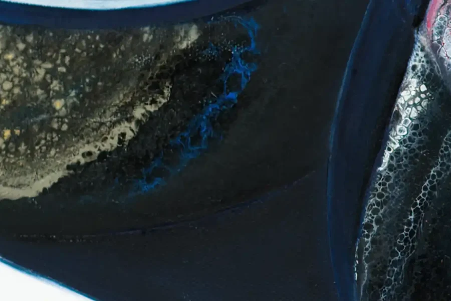 Detailed view of acrylic pour technique on a Sherry wine bottle painting, showcasing intricate patterns and textures.