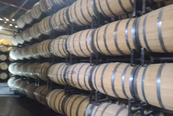 Stacked barrels of bourbon whiskey at LAWS Whiskey House in Denver.