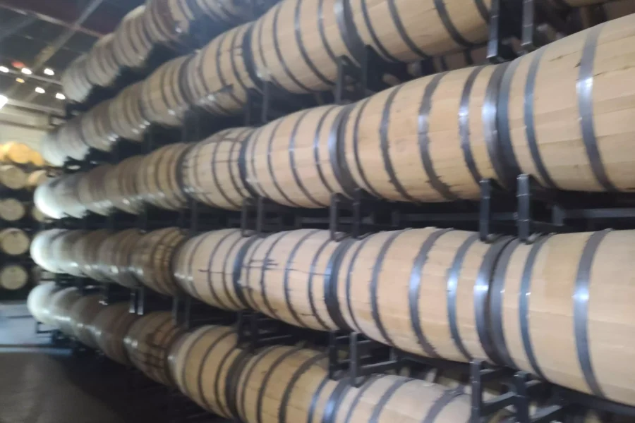 Stacked barrels of bourbon whiskey at LAWS Whiskey House in Denver.